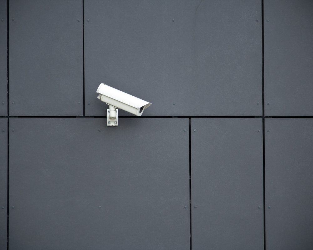 Security camera on dark modern building